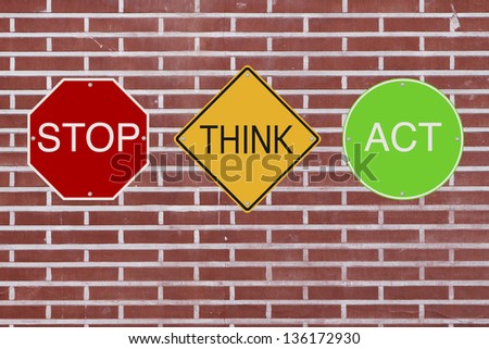 Modified colorful road signs with a safety message mounted on a wall
