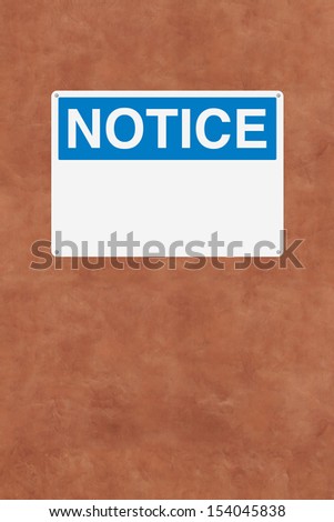 A blank notice sign mounted on a wall