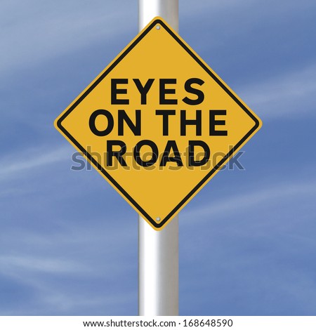 Road safety sign indicating Eyes on the Road