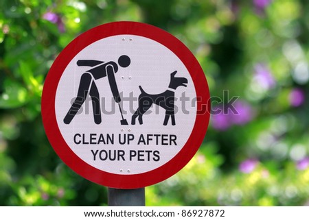 “Clean up after your pets” sign at the park