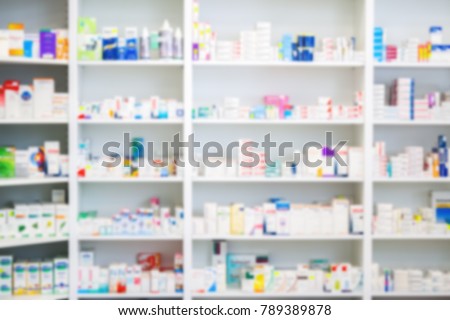 Medicines arranged in shelves at pharmacy out of the focus\
Pharmacy background photo