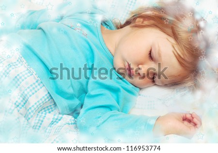 Magic Dreams little princess.Beautiful little girl sleeping in blue pajamas