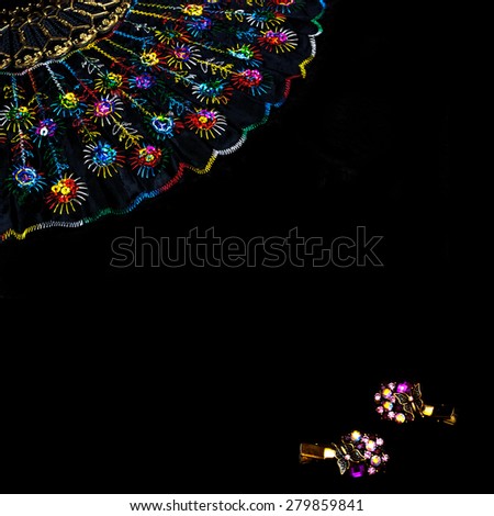 Glamor black background with  female ornaments (hair clips, fan)