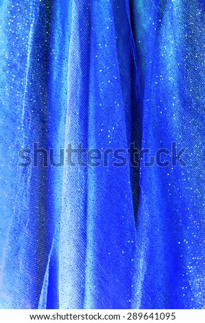 Background from blue delicate fabric with sequin