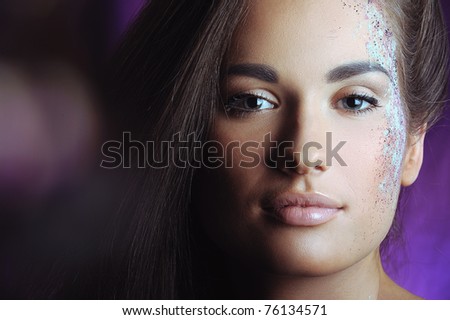 beautiful woman with health skin in color spray and boke