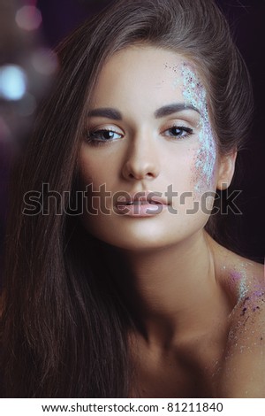 beautiful woman with health skin in color spray and boke