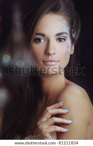beautiful woman with health skin in color spray and boke touch her skin