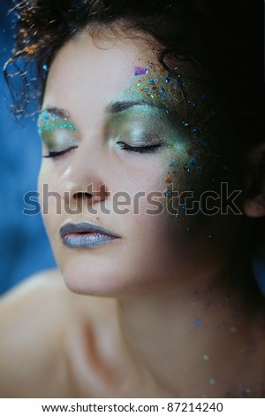 Beautiful woman with bright makeup for New Year or Christmas party