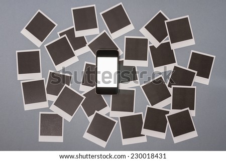 Smartphone with set of real blank instant photo frames background