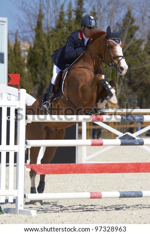 OLIVA, SPAIN - MARCH 10:  An unidentified competitor jumps with his horse at the MET Mediterranean Equestrian Tour on March 10, 2012, Oliva, Spain