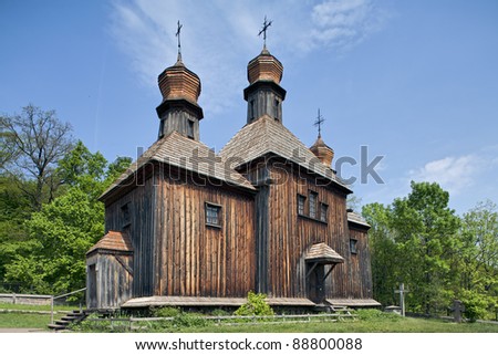 Wooden ancient Ukrainian rural Orthodox Christian church in folk arts museum Pirogovo in Kiev, Ukraine