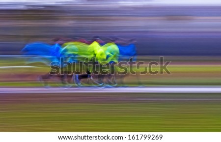 Runners; abstract dynamic capture of runners along the way, camera panning motion blur