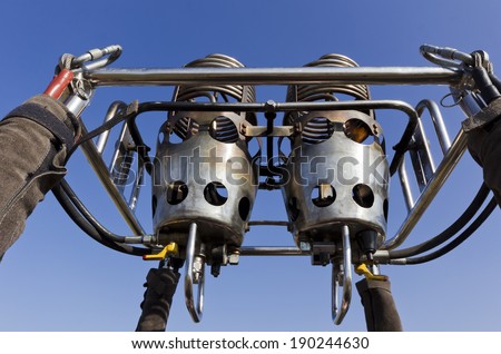 hot air balloon burners, without fire, detail against blue sky