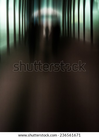 abstract scene with blurred shadow figures against geometric verticals