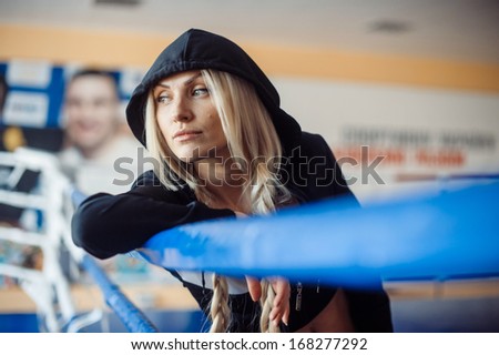 girl boxer in boxing ring in professional female boxing