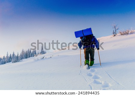 tourist in winter mountains