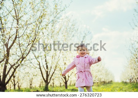 child running outdoors blossom trees. Art processing and retouching photos special.