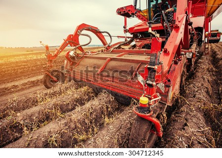 Tractor plowing up the field.