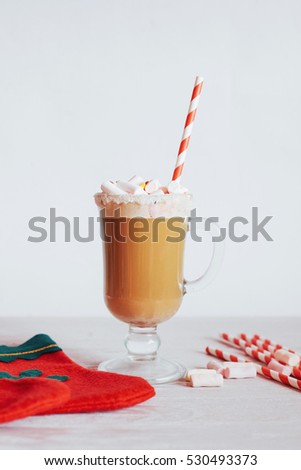 Christmas still life - cup of hot chocolate with marshmallows, candies and toys. New Year. Holiday card. Top view.
