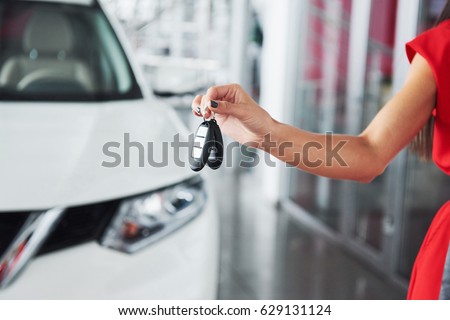 Passing car keys. Cropped closeup of a car dealer holding out car keys to the camera copyspace car dealership salon manager salesman selling buying giving owner profession purchase vehicle concept.