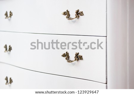 Antique white cupboard drawer closeup