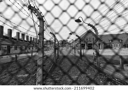 Fences all around to curb any escape attempt by prisoners at Auschwitz (also known as or Oswiecim), Poland - a WW-II site for mass-genocide by Nazis.