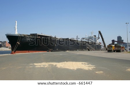 Bulk carrier vessel loading grains directly from trucks.