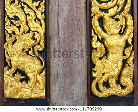 Wood carvings (art on temple wall,Thailand.Gener ality in Thailand, any kind of art decorated in Buddhist church etc. created with money donated by people, no restrict in copy or use)