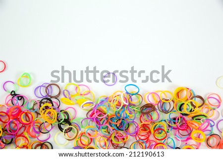 Little girl wearing colorful loom band rubber bracelet