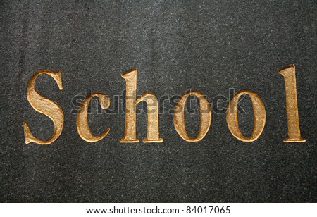 Gold school logo of school