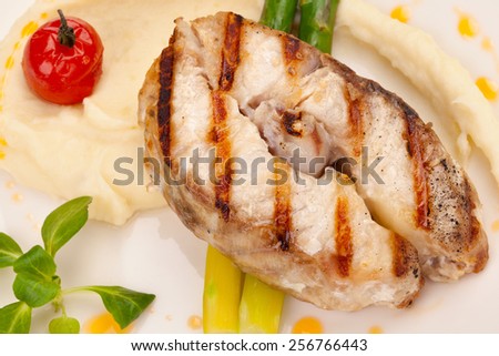 Sturgeon steak with mashed potatoes