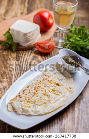Fried pie with cheese and herbs. Qutab.