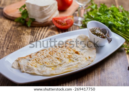 Fried pie with cheese and herbs. Qutab.
