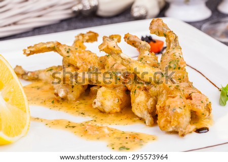 Frog legs stew with herbs