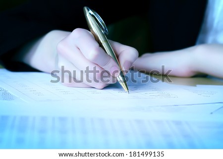 Director signs papers