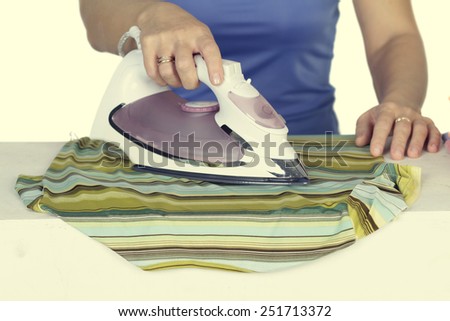 woman irons clothes