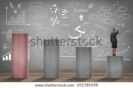 businesswoman standing on lower stage and writing business project