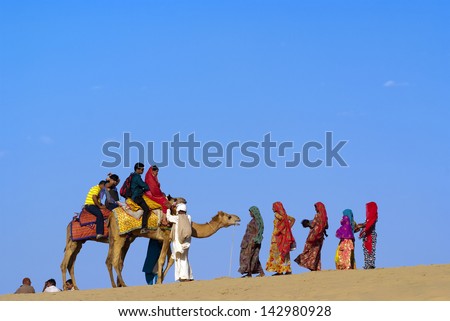 JAISALMER, INDIA-FEB 25: Camel riding at Sam Sand Dune on Feb 25, 2013 in Jaisalmer, India.The activity is part of Desert Festival held in winter to attract both domestic and international tourists.