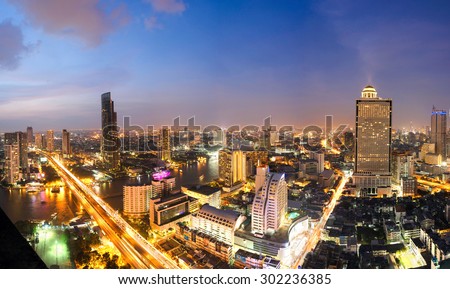 Overview of one of the most important financial districts with bank headquarters, financial institutions and office buildings in Bangkok at sunset