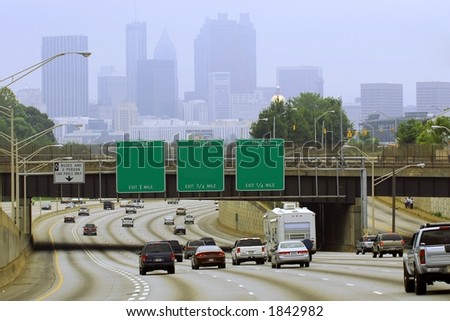 Atlanta cityscape with blank road signs.  Taken on a hazy day on the Labor Day weekend.