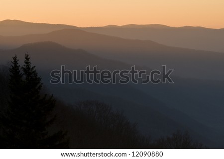 Smoky Mountain sunrise looking over the ridges of several mountain tops on a spring morning.