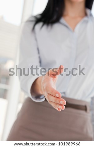 A woman offering her hand to shake