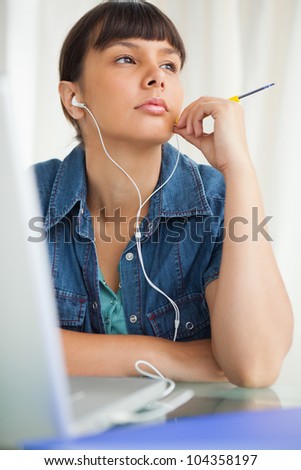 Student devolved to do her homework while listening music