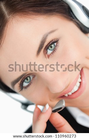 Green eyed woman with headset in close-up