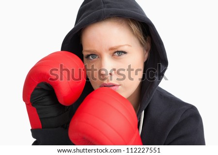 Woman boxing against white background