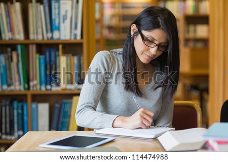 Black-Haired Woman Studying In The Library