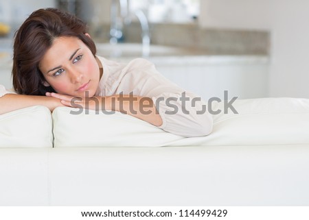 Woman relaxing on the couch and thinking