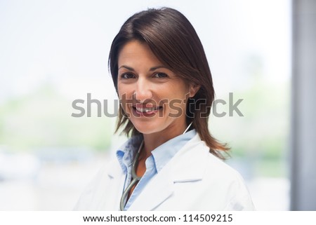 Portrait of doctor in lab coat in hospital