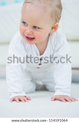 Baby walking on all fours in living room