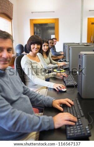 Smiling computer class in college